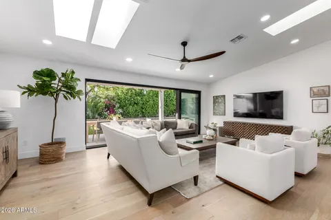 a living room with furniture and a large window