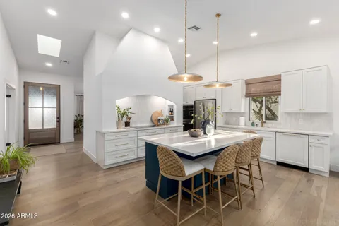 a kitchen with a table and chairs in it