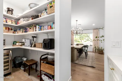 a dining room with furniture and a book shelf
