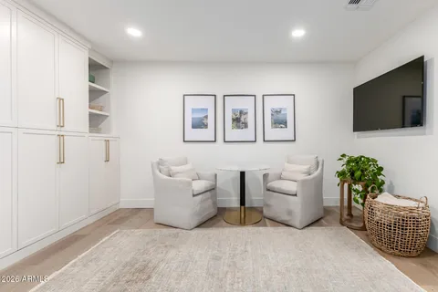 a view of a livingroom with furniture and a flat screen tv
