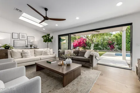 a living room with furniture and a large window