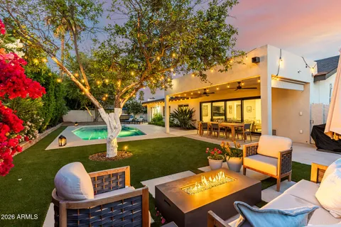 a view of a backyard with sitting area