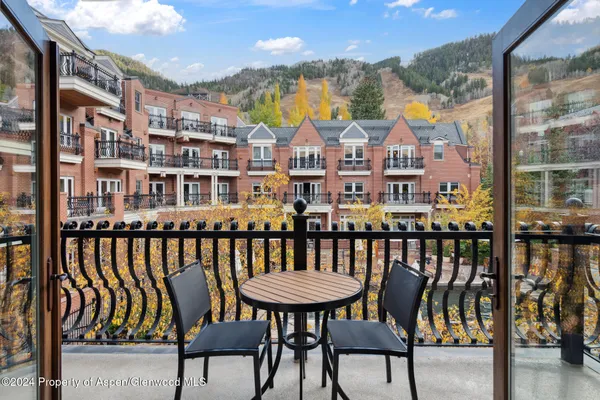 a view of a balcony with chairs