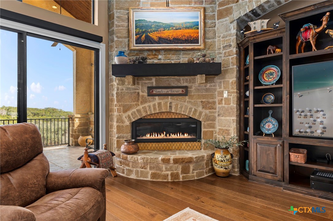 1039 Bluewater Place Spring Branch, TX 78070 - Photo 15 of 48 a living room with furniture and a fireplace