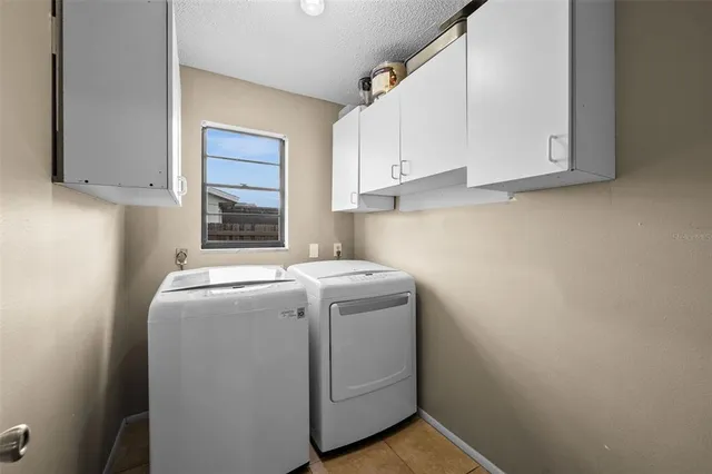 a view of a workspace with furniture and a kitchen