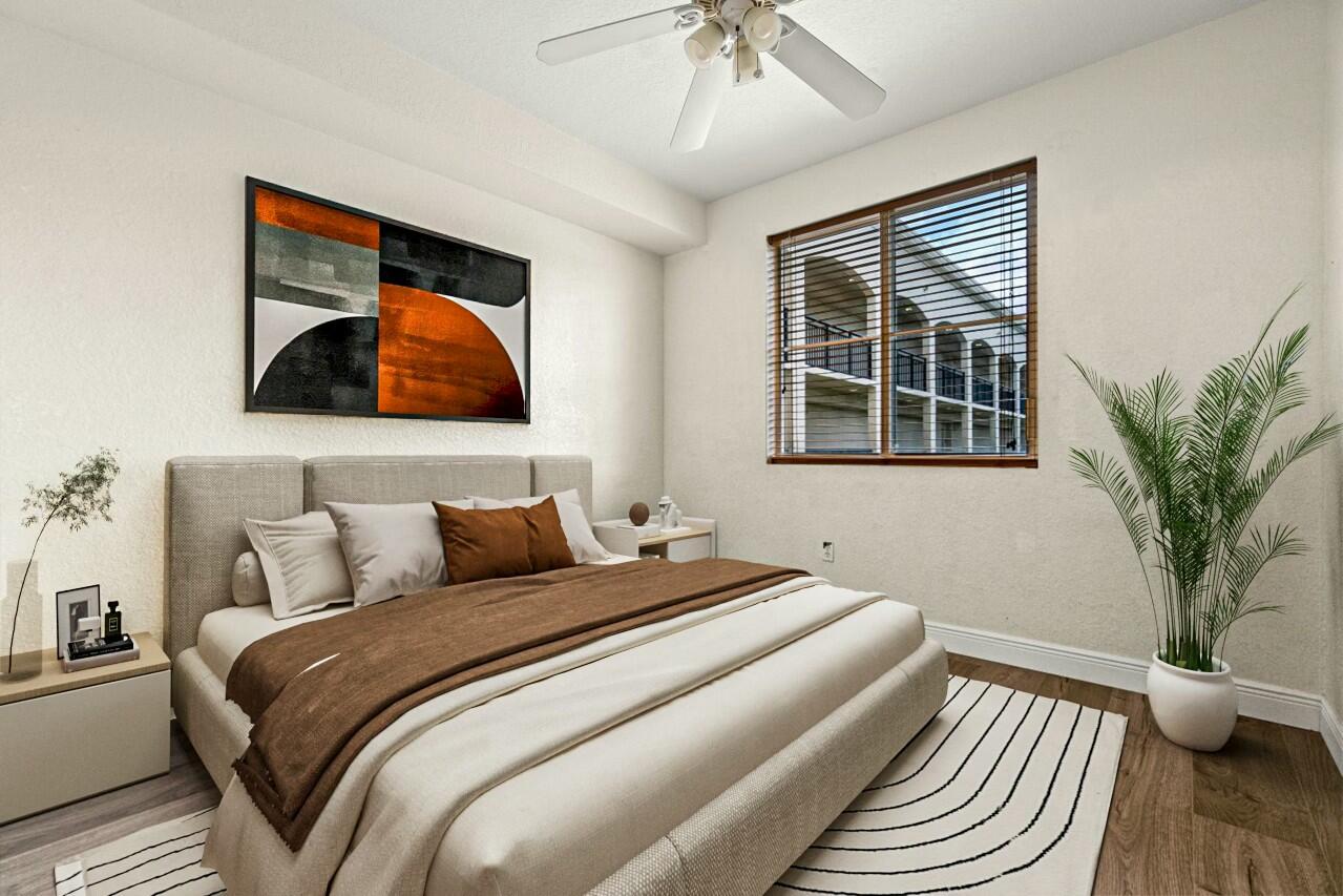 1660 Renaissance Commons Boulevard, Unit 2524 Boynton Beach, FL 33426 - Photo 20 of 27 a bedroom with a bed and a potted plant