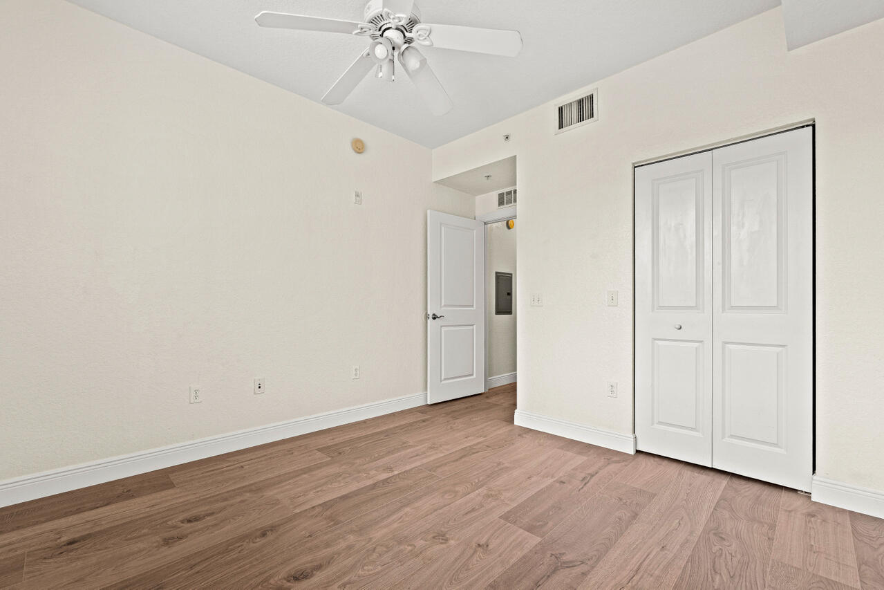 1660 Renaissance Commons Boulevard, Unit 2524 Boynton Beach, FL 33426 - Photo 22 of 27 a view of an empty room with wooden floor