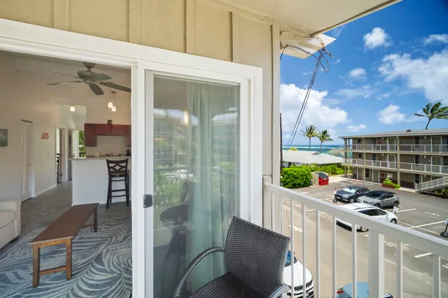 a kitchen that has a lot of furniture a sink and a refrigerator