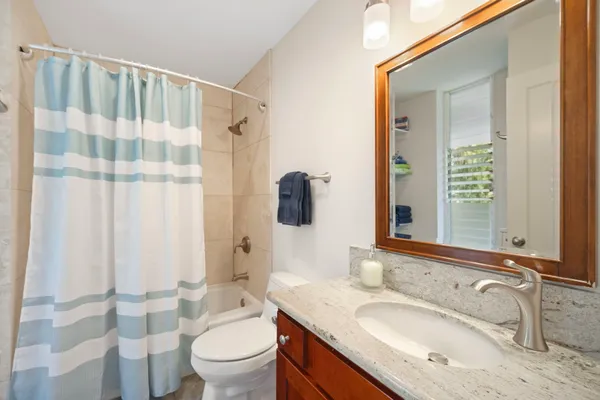 a bathroom with a sink double vanity and a mirror