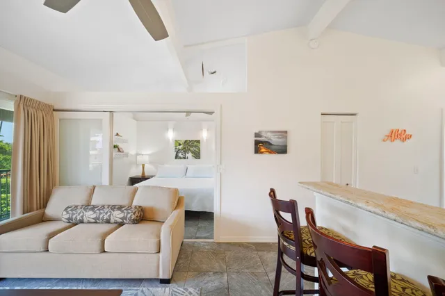 a living room with furniture and a table