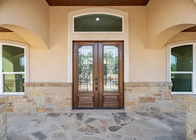 a view of front door with yard