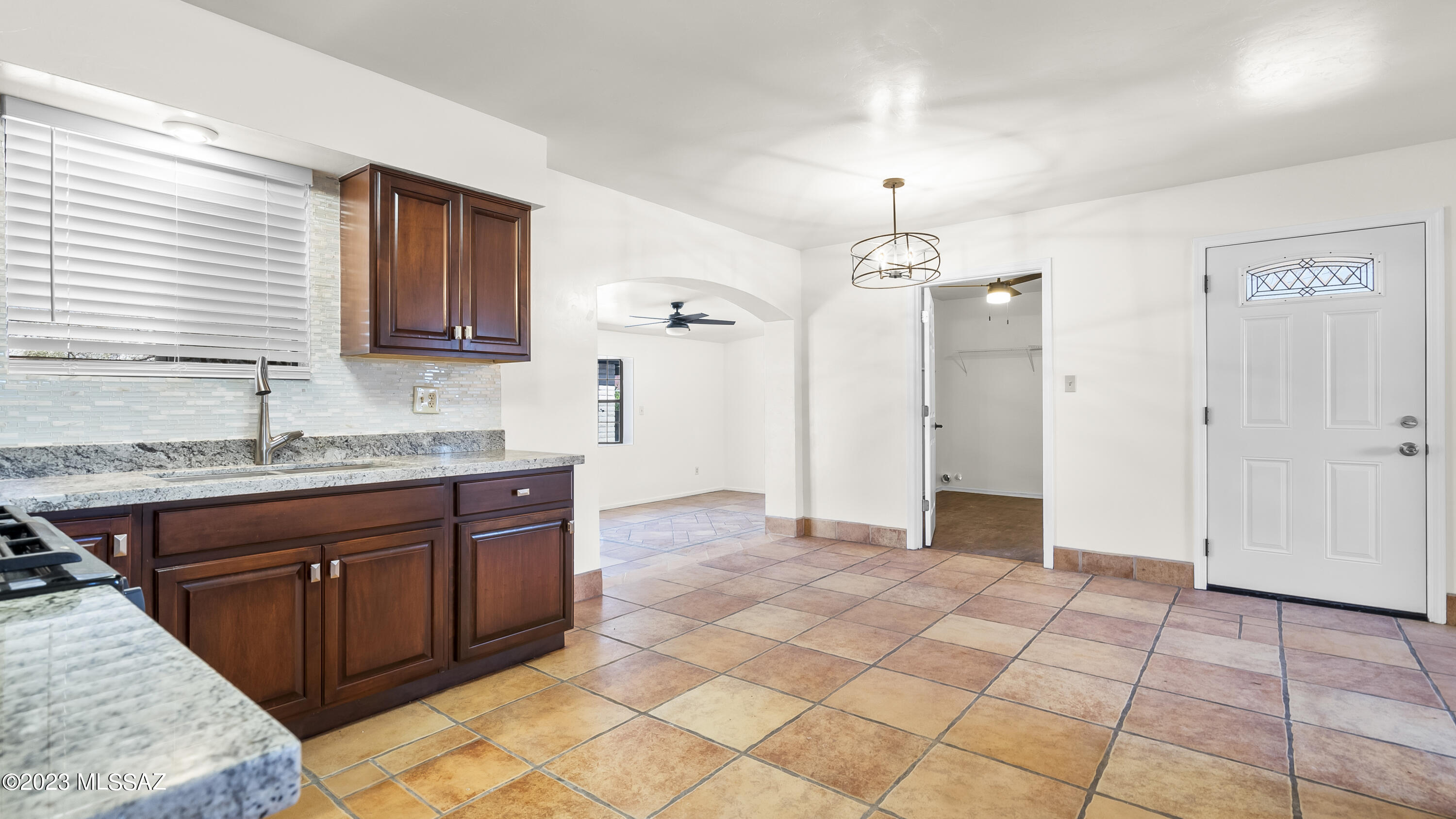 434 Paseo Bocado Rio Rico, AZ 85648 - Photo 8 of 31 a spacious bathroom with a granite countertop sink a mirror and a shower