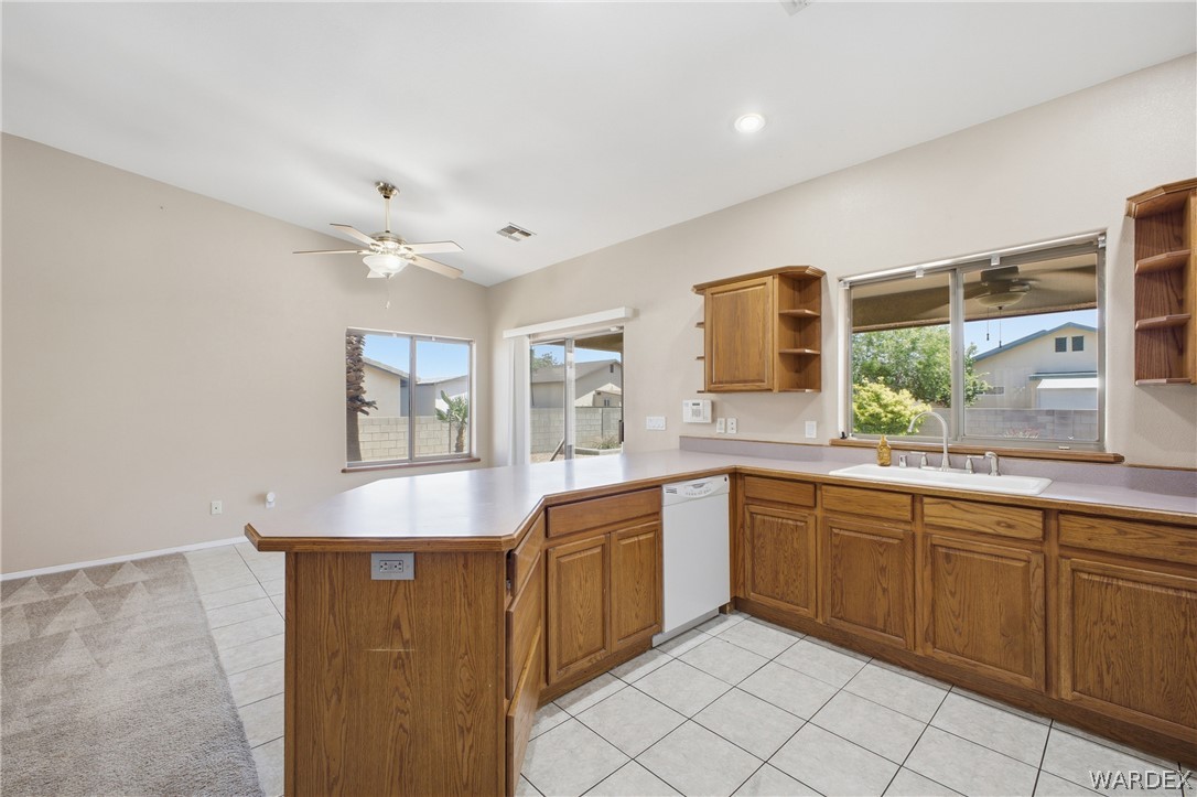 3918 North Eagle Rock Road Kingman, AZ 86409 - Photo 7 of 44 a large kitchen with kitchen island a sink stainless steel appliances and cabinets