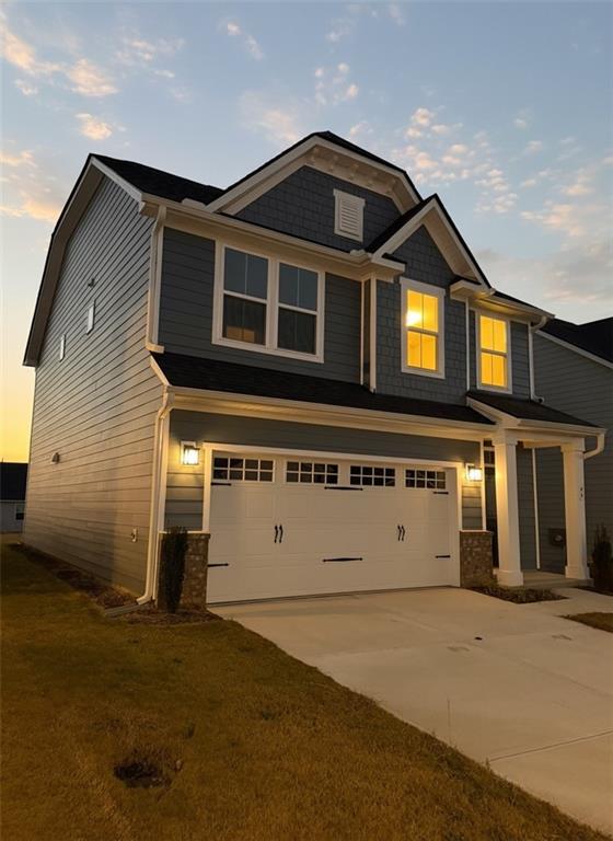 a front view of a house with a garage
