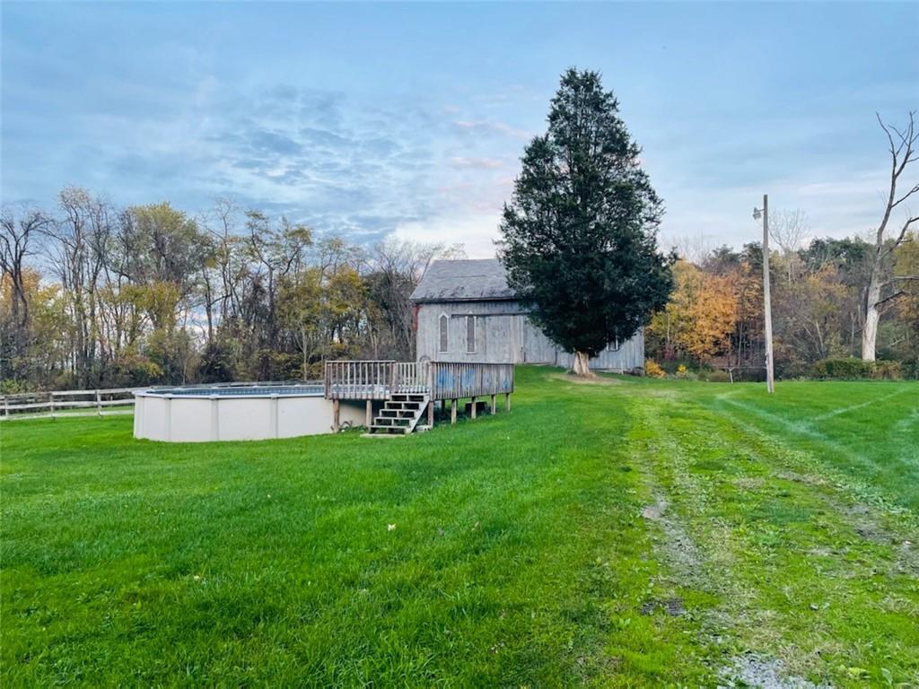 4270 Edinburg Road New Castle, PA 16102 - Photo 3 of 25 a view of a house with a yard and sitting area