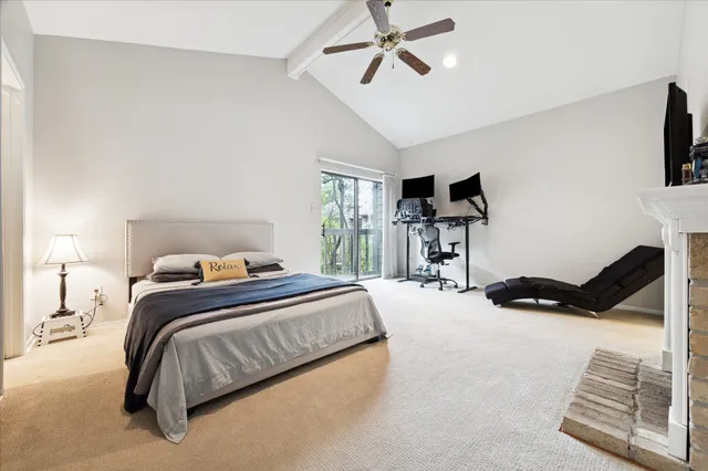 a bedroom with a bed and a flat tv screen