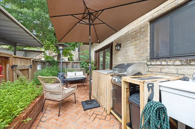 a patio with a patio table and chairs