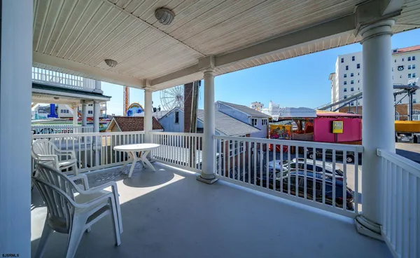 a view of a porch with furniture