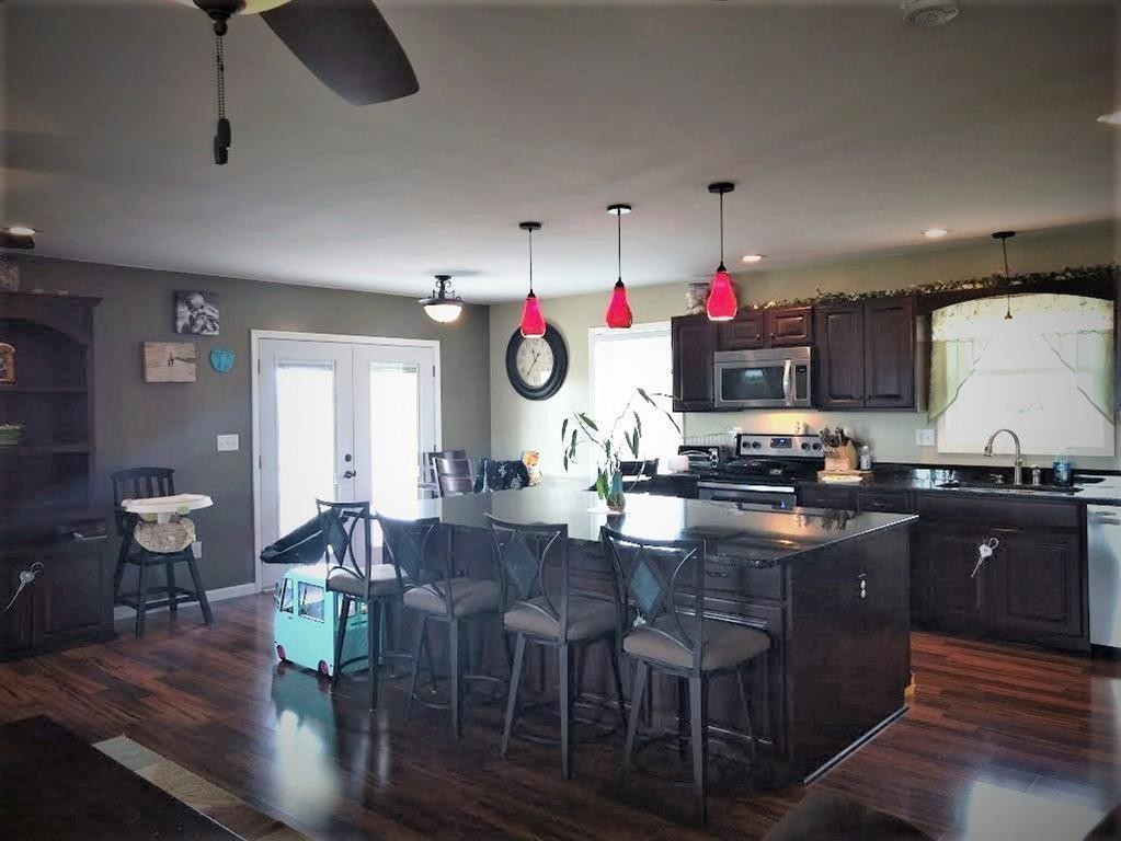 310 Highway 305 Decatur, TN 37322 - Photo 12 of 31 a kitchen with granite countertop lots of wooden furniture cabinets and stainless steel appliances
