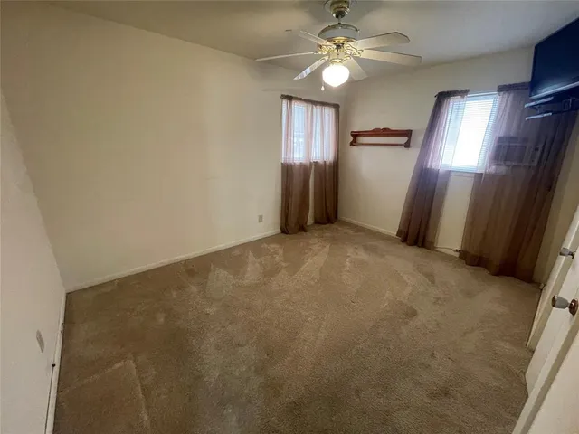a view of an empty room with a balcony