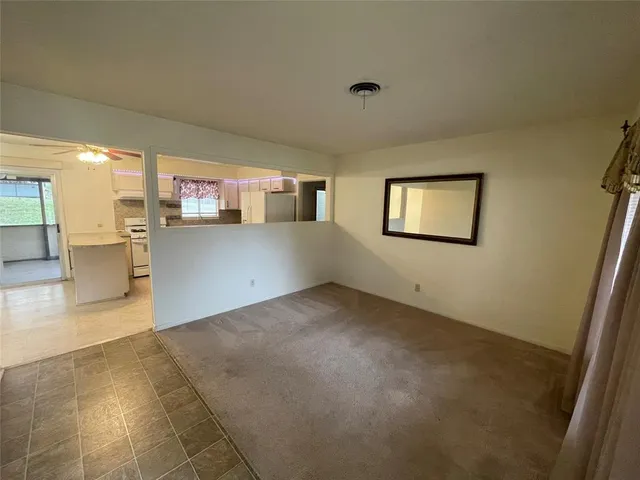 a view of a kitchen with furniture and a window