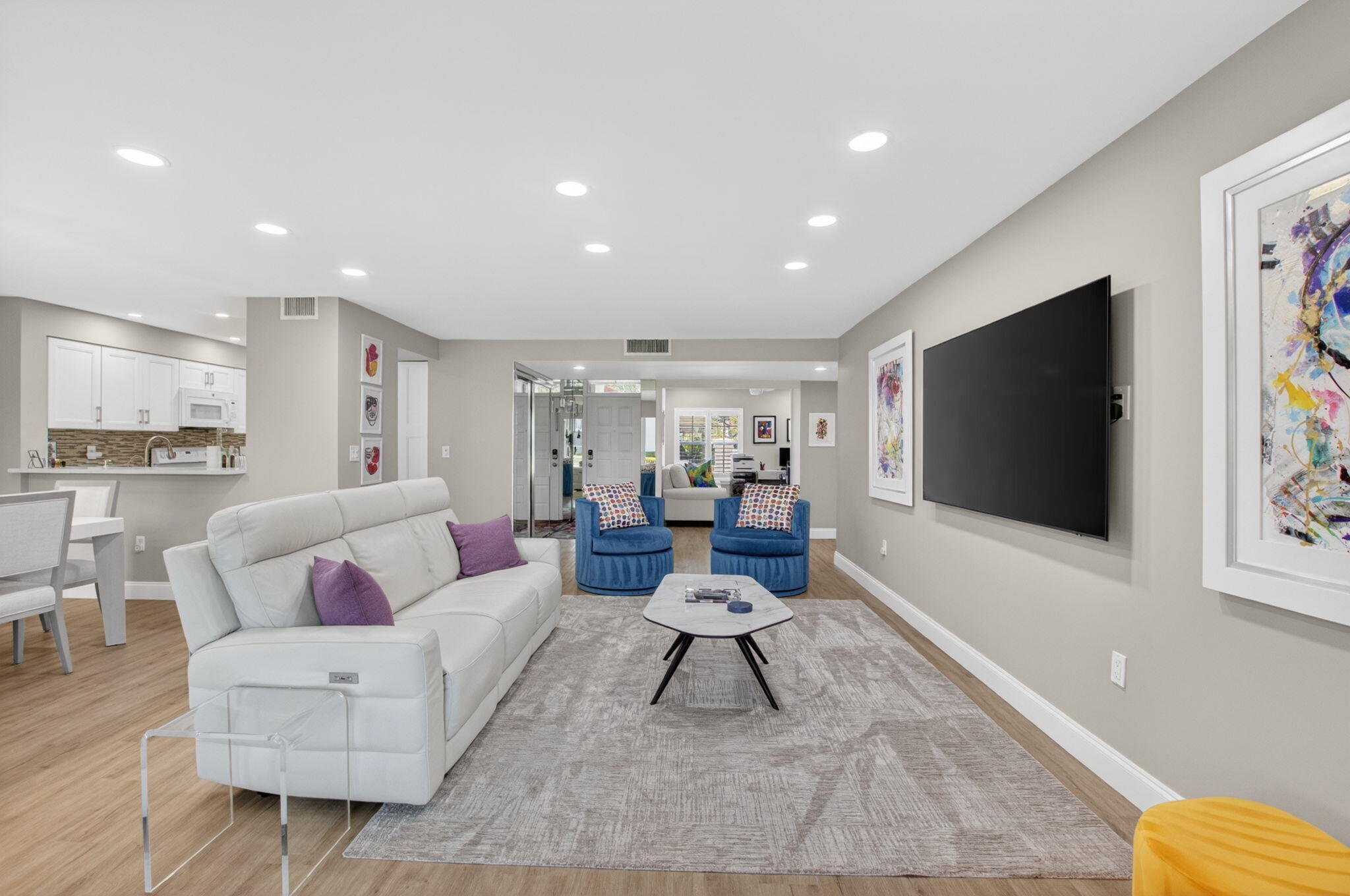 7669 Springwater Place, Unit 102 Boynton Beach, FL 33437 - Photo 11 of 116 a living room with furniture and a flat screen tv