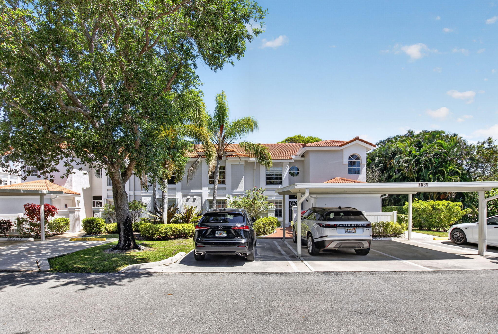 7669 Springwater Place, Unit 102 Boynton Beach, FL 33437 - Photo 2 of 116 a car parked in front of a house