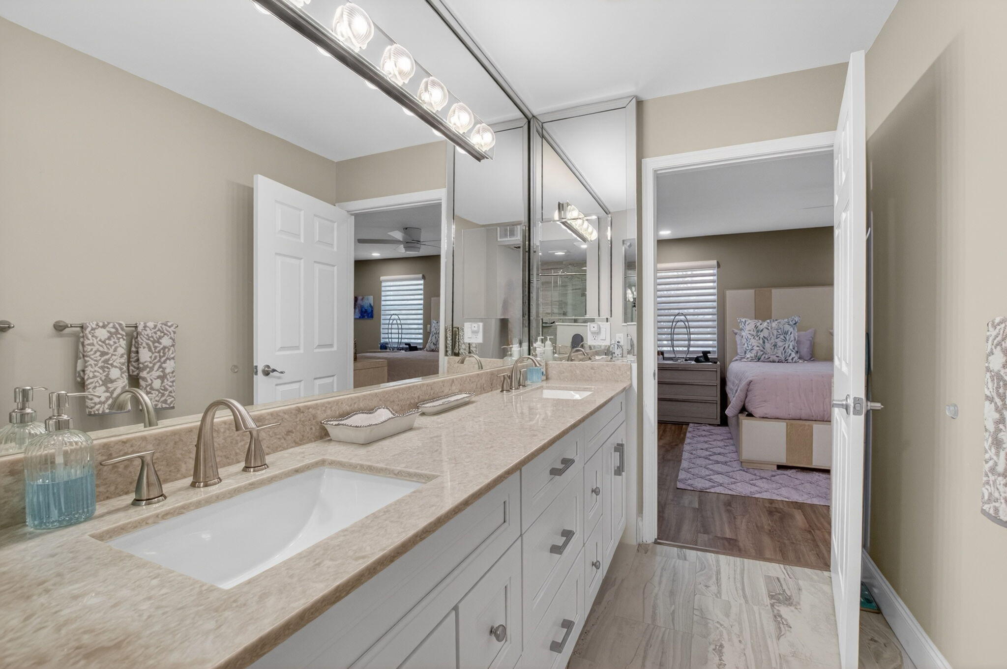 7669 Springwater Place, Unit 102 Boynton Beach, FL 33437 - Photo 28 of 116 a en suite bathroom with double sink and a large mirror