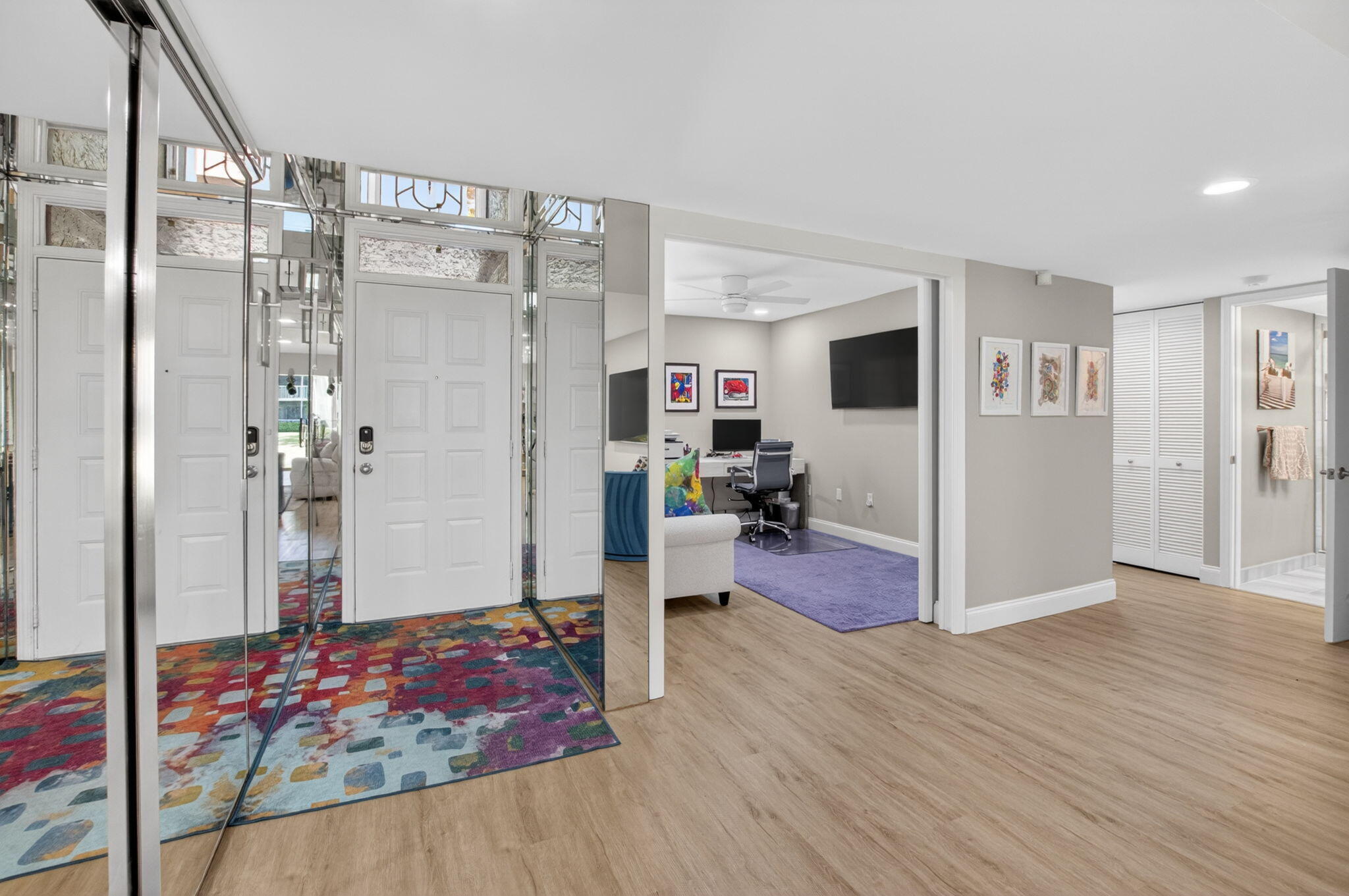 7669 Springwater Place, Unit 102 Boynton Beach, FL 33437 - Photo 3 of 116 a living room with furniture and a wooden floor