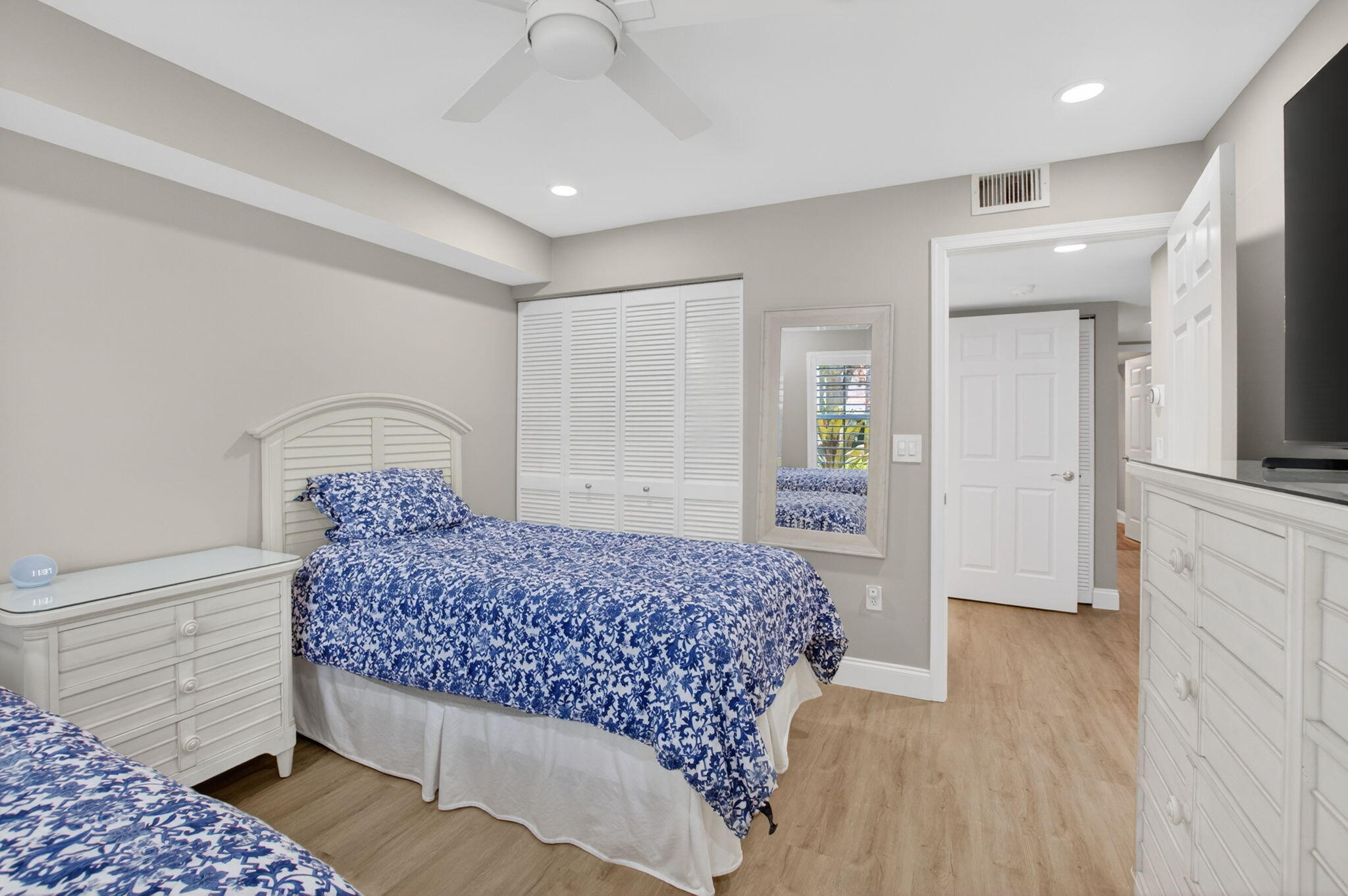 7669 Springwater Place, Unit 102 Boynton Beach, FL 33437 - Photo 33 of 116 a bedroom with a bed and a view of bedroom