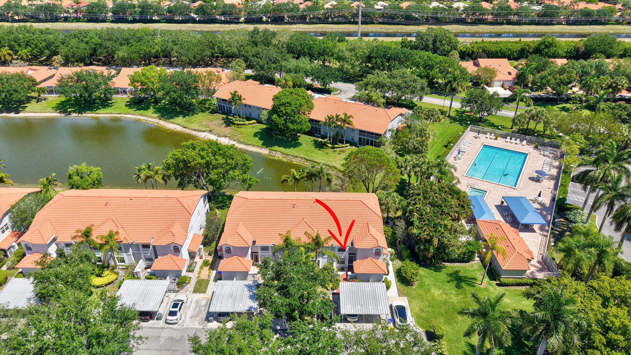 7669 Springwater Place, Unit 102 Boynton Beach, FL 33437 - Photo 44 of 116 an aerial view of house with yard swimming pool and outdoor seating