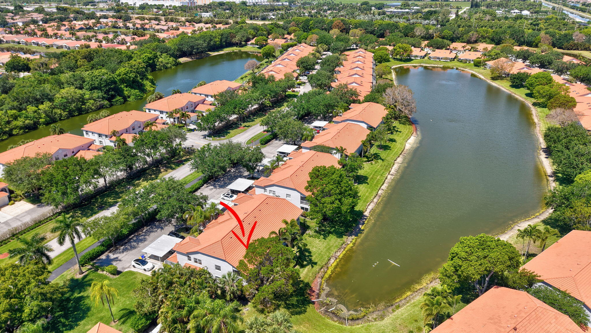 7669 Springwater Place, Unit 102 Boynton Beach, FL 33437 - Photo 47 of 116 an aerial view of residential houses with outdoor space and swimming pool