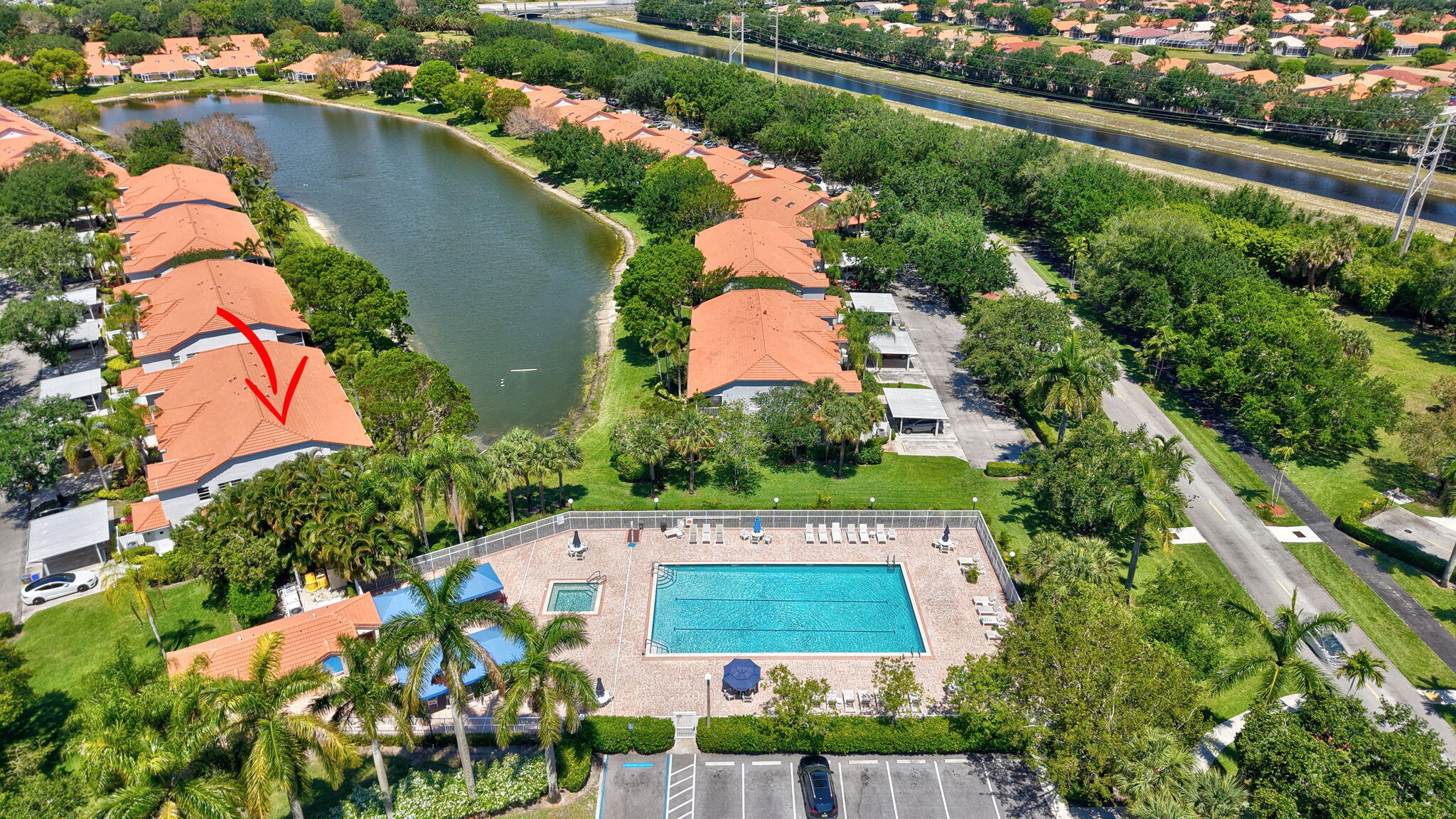 7669 Springwater Place, Unit 102 Boynton Beach, FL 33437 - Photo 52 of 116 an aerial view of a house with a yard and outdoor seating