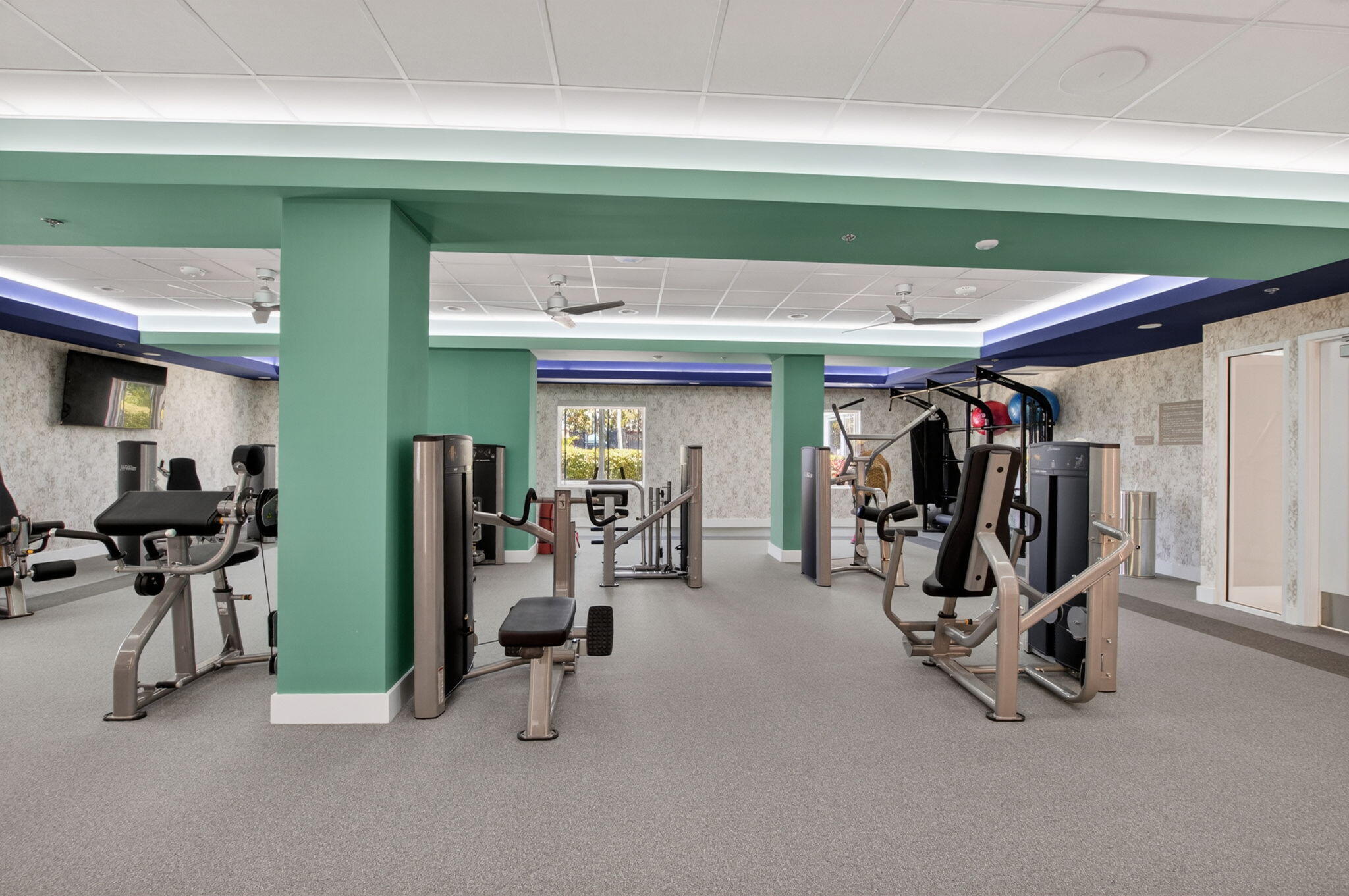 7669 Springwater Place, Unit 102 Boynton Beach, FL 33437 - Photo 76 of 116 a view of a room with gym equipment