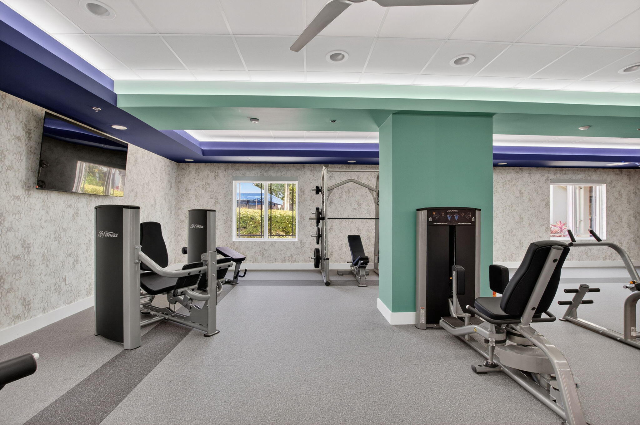 7669 Springwater Place, Unit 102 Boynton Beach, FL 33437 - Photo 78 of 116 a view of a livingroom with gym equipment