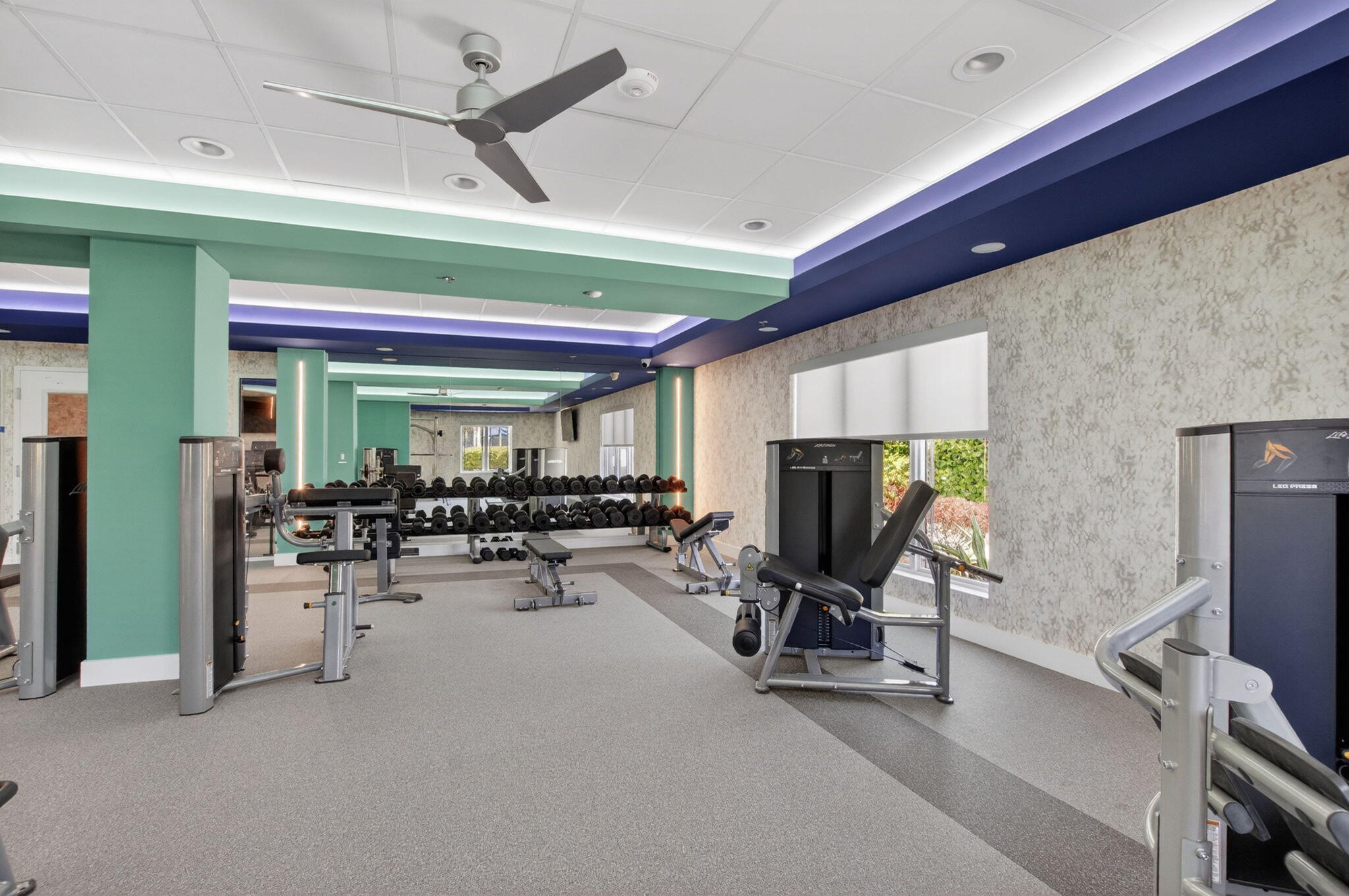 7669 Springwater Place, Unit 102 Boynton Beach, FL 33437 - Photo 79 of 116 a view of a room with gym equipment