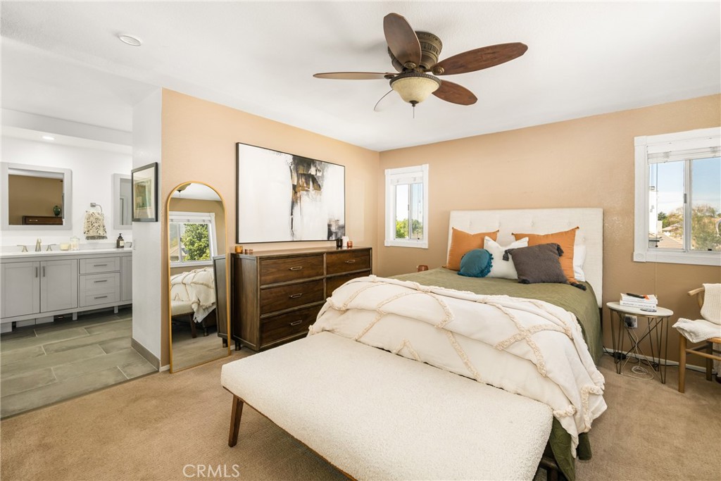 1985 Shady Brook Way Upland, CA 91784 - Photo 33 of 51 a spacious bedroom with a bed and a chandelier