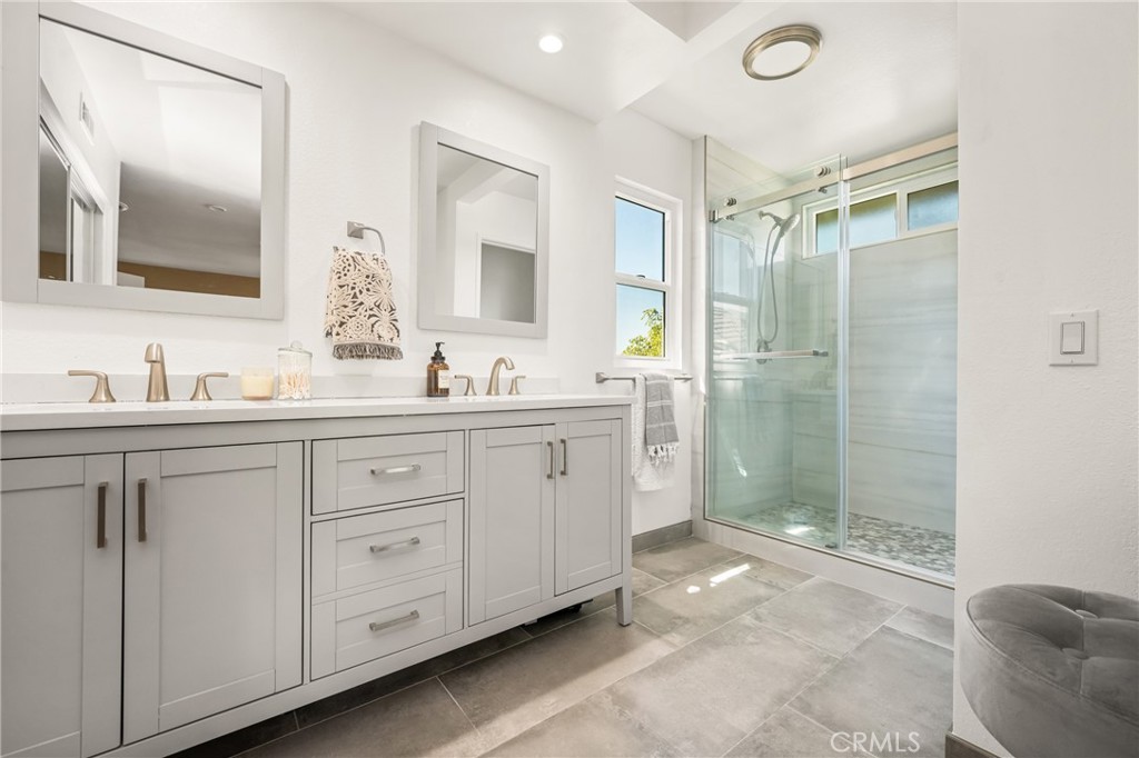 1985 Shady Brook Way Upland, CA 91784 - Photo 35 of 51 a spacious bathroom with double sink and a mirror