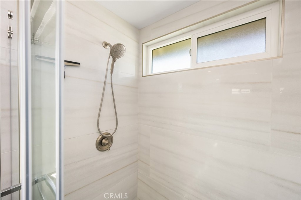 1985 Shady Brook Way Upland, CA 91784 - Photo 37 of 51 a bathroom with a glass shower door