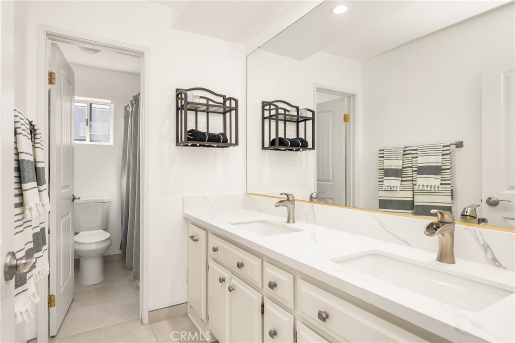 1985 Shady Brook Way Upland, CA 91784 - Photo 39 of 51 a bathroom with a sink and a toilet