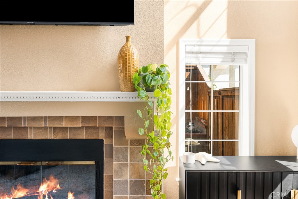 1985 Shady Brook Way Upland, CA 91784 - Photo 4 of 51 a view of a fireplace and potted plant in front of a door
