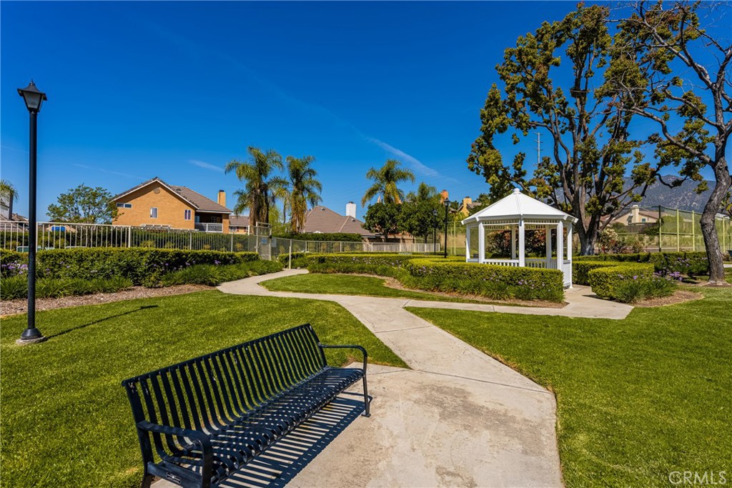 1985 Shady Brook Way Upland, CA 91784 - Photo 44 of 51 a view of an house with backyard and a tree
