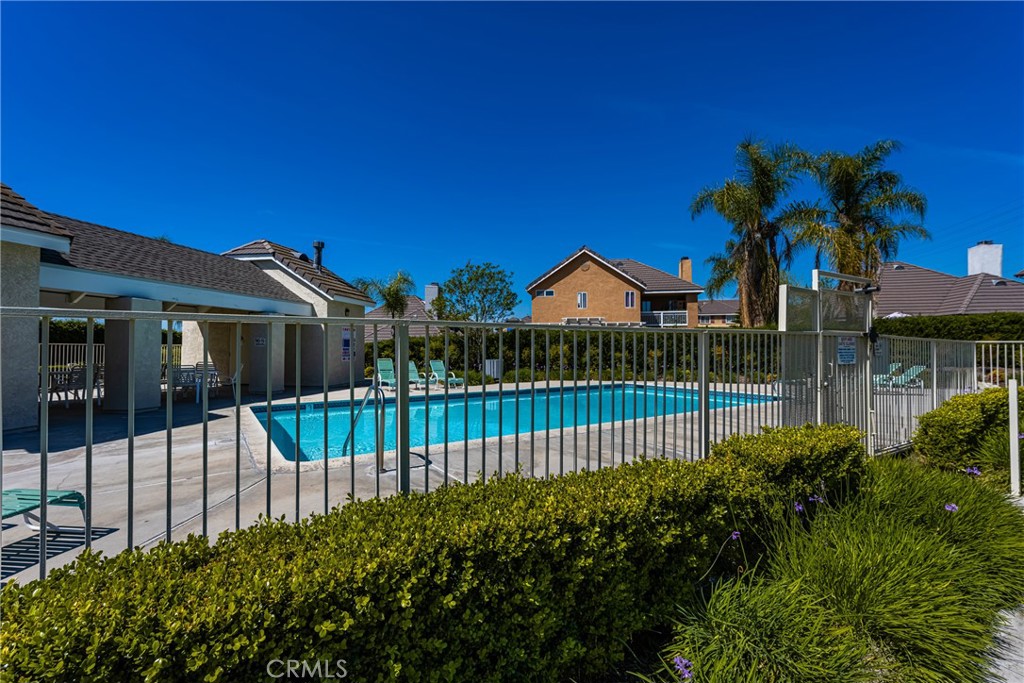 1985 Shady Brook Way Upland, CA 91784 - Photo 45 of 51 a view of a house with a small yard and wooden fence