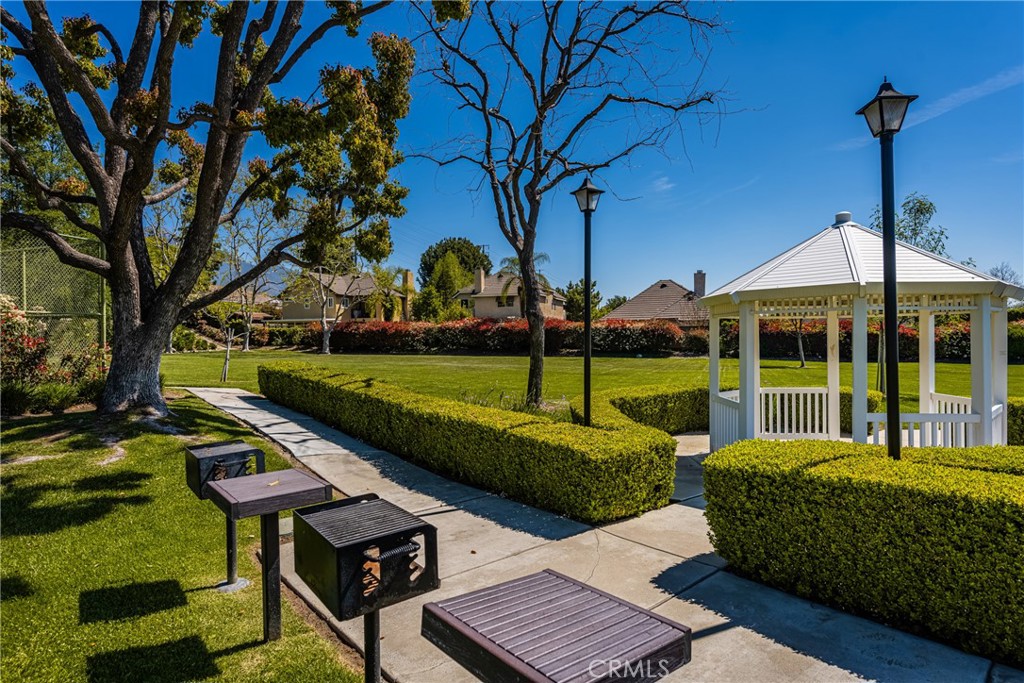 1985 Shady Brook Way Upland, CA 91784 - Photo 49 of 51 a view of a garden with a bench