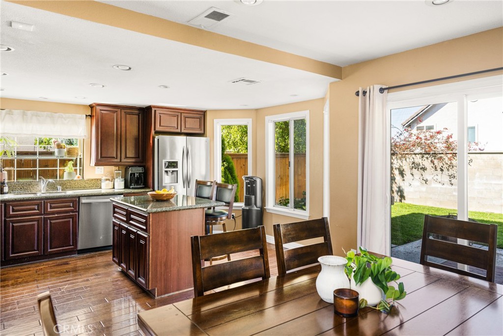 1985 Shady Brook Way Upland, CA 91784 - Photo 9 of 51 a large living room with kitchen island granite countertop furniture a large window and a sink