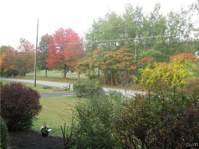 358 Blue Ridge Road Saylorsburg, PA 18353 - Photo 8 of 43 a view of a lake with a house in a yard