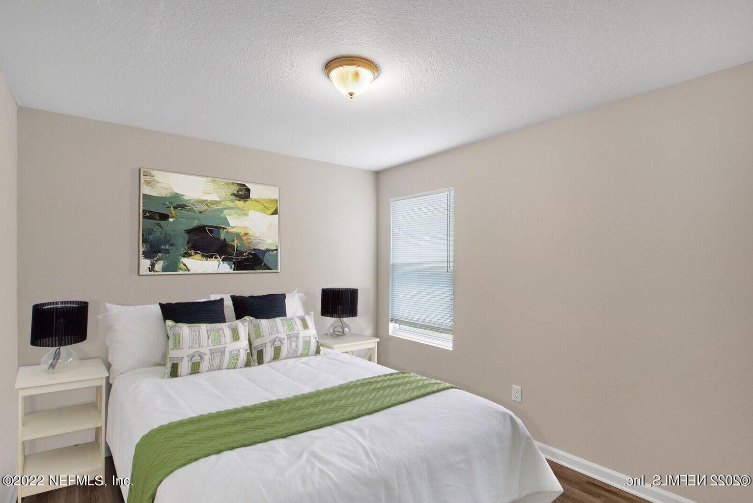 2235 3rd Avenue Jacksonville, FL 32208 - Photo 12 of 22 a bedroom with a bed and a flat screen tv