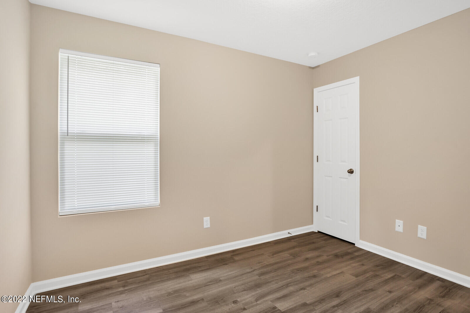 2235 3rd Avenue Jacksonville, FL 32208 - Photo 13 of 22 an empty room with wooden floor and windows