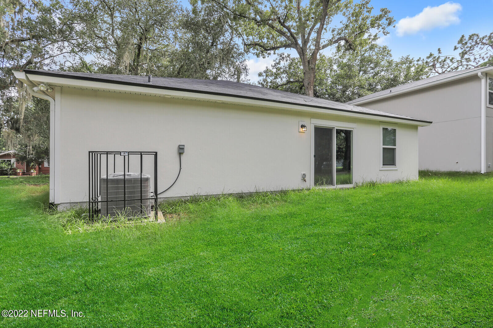 2235 3rd Avenue Jacksonville, FL 32208 - Photo 20 of 22 a backyard of a house with lots of green space