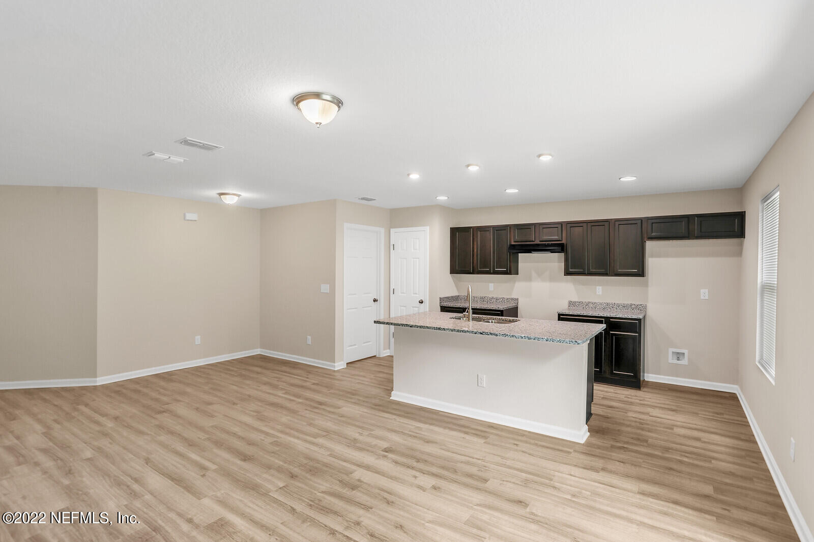 2235 3rd Avenue Jacksonville, FL 32208 - Photo 6 of 22 a view of kitchen with microwave oven stove and white cabinets